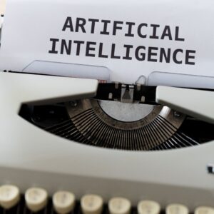 Close-up of a typewriter with the words Artificial Intelligence typed on paper, illustrating AI ad creative tools